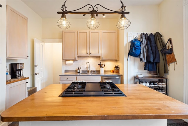 625 S Aiken Ave, Shadyside, PA 15232 - kitchen featuring butcher block countertops, black gas stovetop, a center island, decorative backsplash, and stainless steel dishwasher