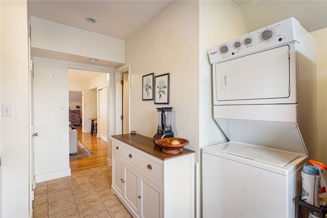 625 S Aiken Ave, Shadyside, PA 15232 - laundry area featuring stacked washing machine and dryer and light tile patterned floors