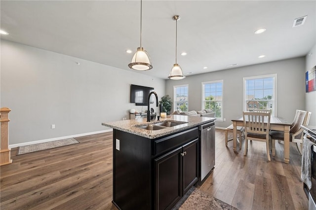 1431 Hastings Cres, South Fayette, PA 15017 - kitchen featuring stainless steel dishwasher, dark wood finished floors, open floor plan, dark cabinetry, and recessed lighting