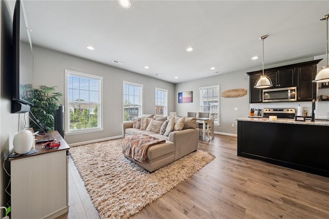 1431 Hastings Cres, South Fayette, PA 15017 - living area with wood finished floors and recessed lighting