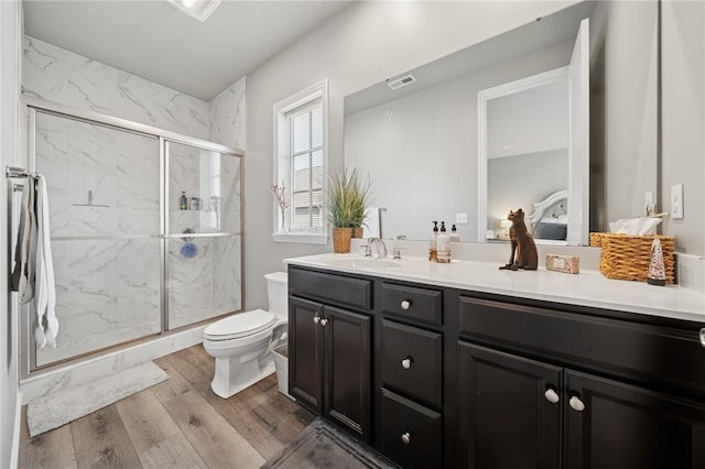 1431 Hastings Cres, South Fayette, PA 15017 - bathroom with double vanity, a marble finish shower, and wood finished floors