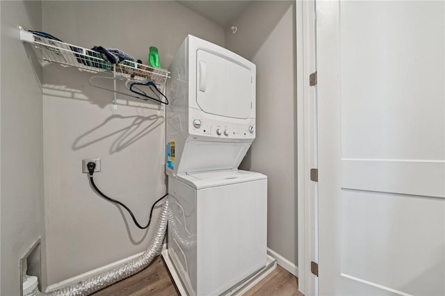 1431 Hastings Cres, South Fayette, PA 15017 - washroom with stacked washer / dryer and light wood-style flooring