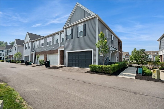 1431 Hastings Cres, South Fayette, PA 15017 - view of front facade with a residential view, board and batten siding, and a garage