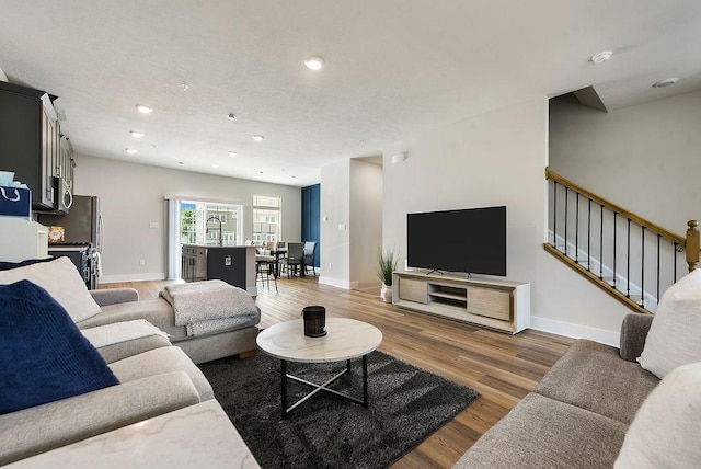 1408 Commons Ln, South Fayette, PA 15017 - living area featuring wood finished floors, recessed lighting, and stairs