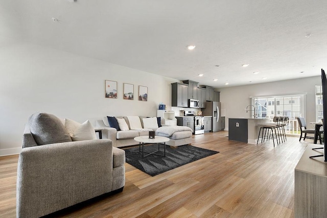 1408 Commons Ln, South Fayette, PA 15017 - living area with light wood finished floors and recessed lighting