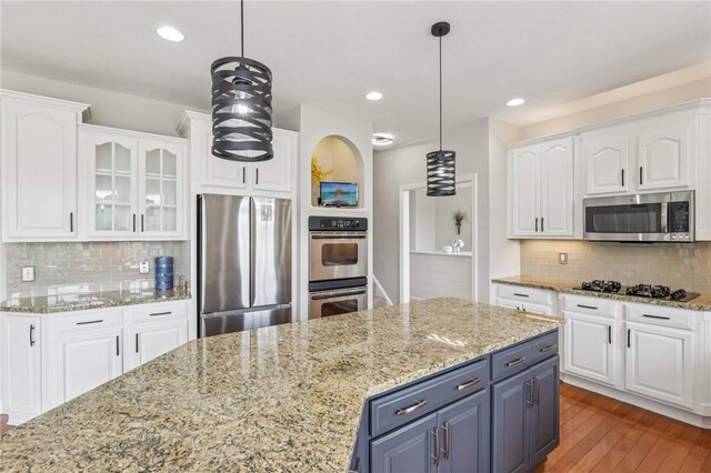 203 Cashmere Ct, Cranberry Twp, PA 16066 - kitchen with appliances with stainless steel finishes, white cabinetry, tasteful backsplash, and recessed lighting
