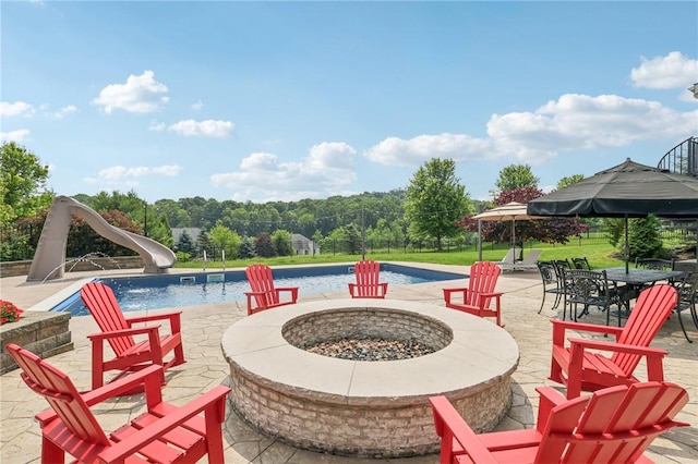 203 Cashmere Ct, Cranberry Twp, PA 16066 - swimming pool featuring a fire pit, a water slide, and a patio