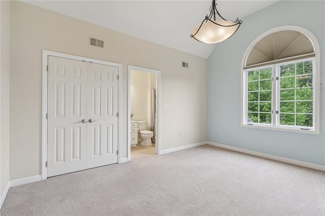 203 Cashmere Ct, Cranberry Twp, PA 16066 - unfurnished bedroom featuring carpet flooring, a closet, lofted ceiling, and ensuite bathroom