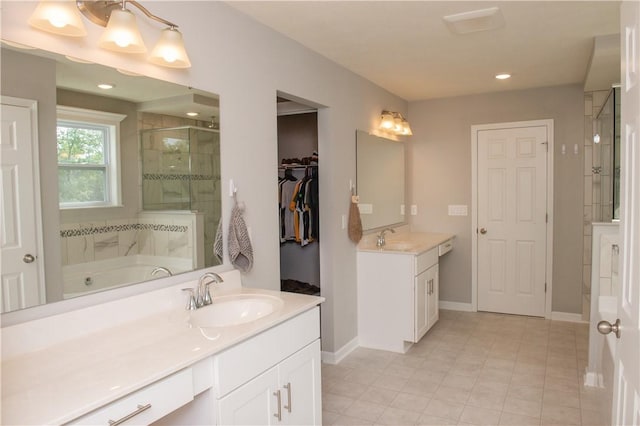 132 Hidden Acres Dr, Forward Twp, PA 16033 - bathroom featuring a stall shower, two vanities, a bath, tile patterned floors, and recessed lighting