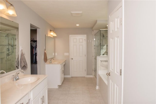 132 Hidden Acres Dr, Forward Twp, PA 16033 - full bath featuring a shower stall, two vanities, a bath, tile patterned floors, and recessed lighting