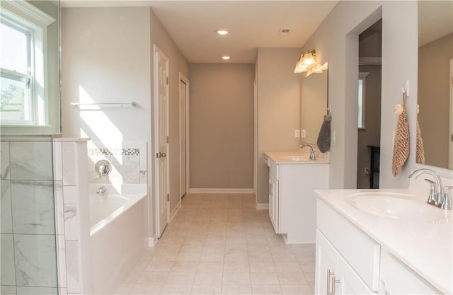 132 Hidden Acres Dr, Forward Twp, PA 16033 - full bath featuring two vanities, a garden tub, recessed lighting, and tile patterned floors