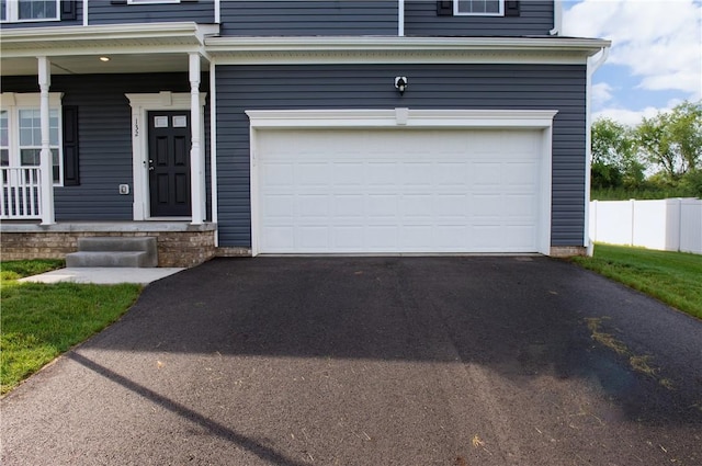 132 Hidden Acres Dr, Forward Twp, PA 16033 - garage featuring asphalt driveway and covered porch
