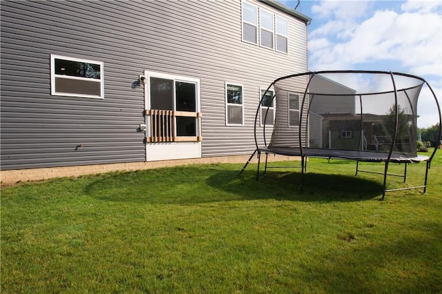 132 Hidden Acres Dr, Forward Twp, PA 16033 - back of property featuring a trampoline and a lawn