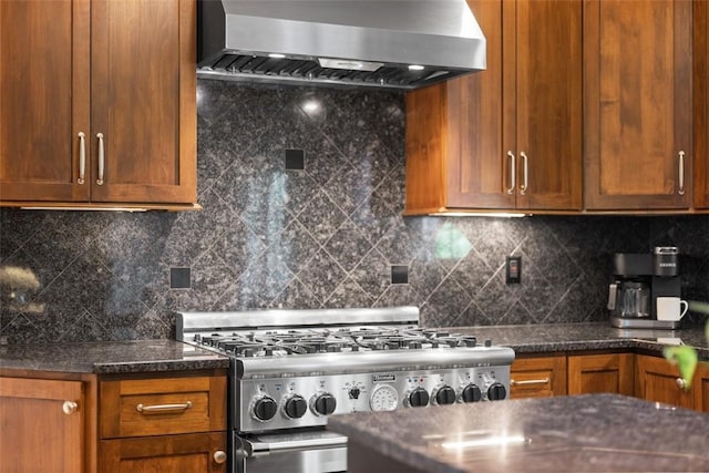 116 Bunker Hill Dr, Peters Twp, PA 15317 - kitchen featuring stove, wall chimney exhaust hood, backsplash, and brown cabinetry
