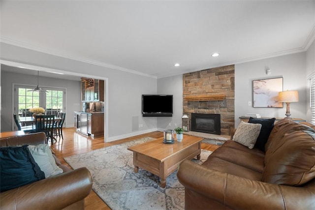 116 Bunker Hill Dr, Peters Twp, PA 15317 - living room with crown molding, light wood-style flooring, recessed lighting, and a fireplace