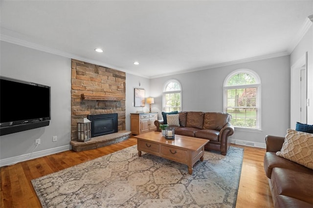 116 Bunker Hill Dr, Peters Twp, PA 15317 - living room with ornamental molding, light wood-style floors, a stone fireplace, and recessed lighting