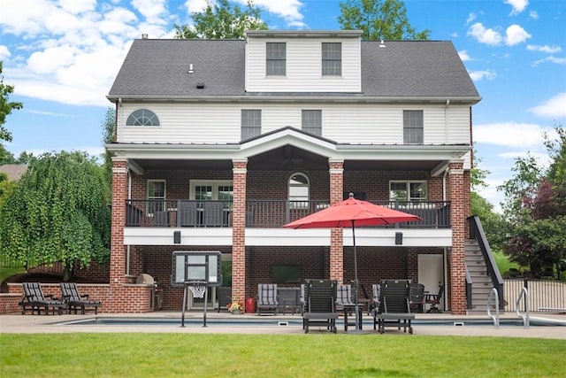 116 Bunker Hill Dr, Peters Twp, PA 15317 - rear view of house with a patio, a balcony, brick siding, and an outdoor pool