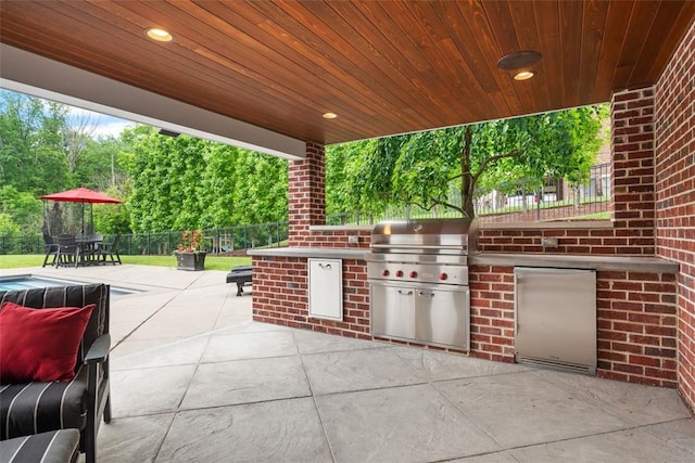 116 Bunker Hill Dr, Peters Twp, PA 15317 - view of patio with area for grilling, outdoor dining space, and view of wooded area