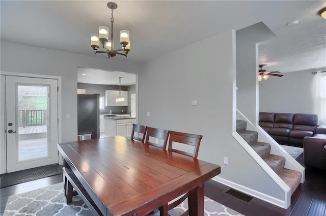 1707 Cosmos St, Lincoln Place, PA 15207 - dining room with a chandelier, light wood-type flooring, ceiling fan, and stairway