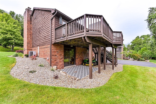 317 Bridlewood Dr, Hempfield Twp Wml, PA 15601 - rear view of property with brick siding, a deck, a yard, and a chimney