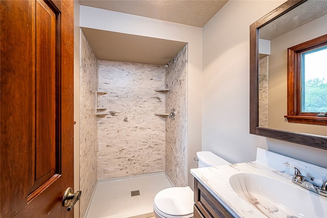 317 Bridlewood Dr, Hempfield Twp Wml, PA 15601 - bathroom featuring a stall shower, vanity, and a textured ceiling
