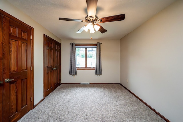 317 Bridlewood Dr, Hempfield Twp Wml, PA 15601 - unfurnished bedroom featuring carpet flooring, a ceiling fan, and a closet