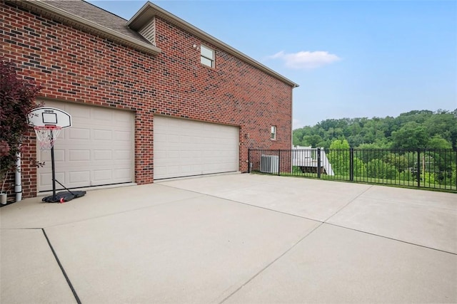 306 Hedgerow Dr, Peters Twp, PA 15367 - view of side of property featuring concrete driveway, brick siding, and a garage
