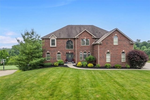 306 Hedgerow Dr, Peters Twp, PA 15367 - colonial-style house featuring a front lawn and brick siding