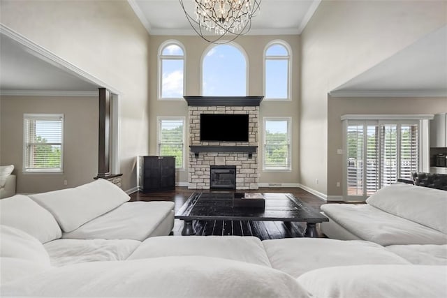 306 Hedgerow Dr, Peters Twp, PA 15367 - living area with a chandelier, plenty of natural light, dark wood-type flooring, a high ceiling, and crown molding