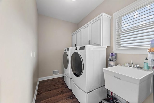 306 Hedgerow Dr, Peters Twp, PA 15367 - laundry room with separate washer and dryer, cabinet space, and dark wood finished floors
