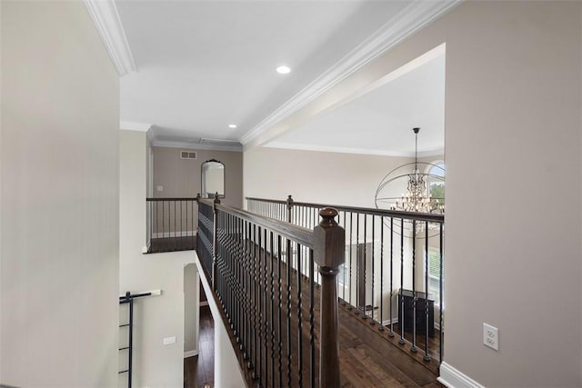 306 Hedgerow Dr, Peters Twp, PA 15367 - corridor with wood finished floors, ornamental molding, an upstairs landing, a chandelier, and recessed lighting