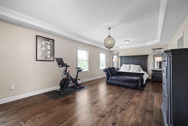 306 Hedgerow Dr, Peters Twp, PA 15367 - bedroom featuring a tray ceiling, dark wood-type flooring, ornamental molding, and a chandelier