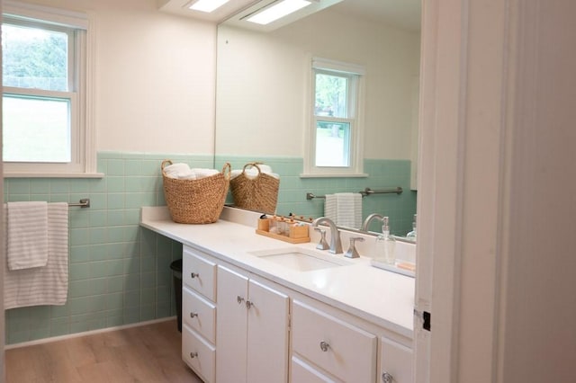 8 Windycrest Dr, Patterson Twp, PA 15010 - bathroom featuring tile walls, vanity, wainscoting, and wood finished floors