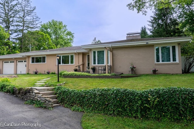 8 Windycrest Dr, Patterson Twp, PA 15010 - single story home featuring an attached garage, a chimney, a front yard, brick siding, and driveway