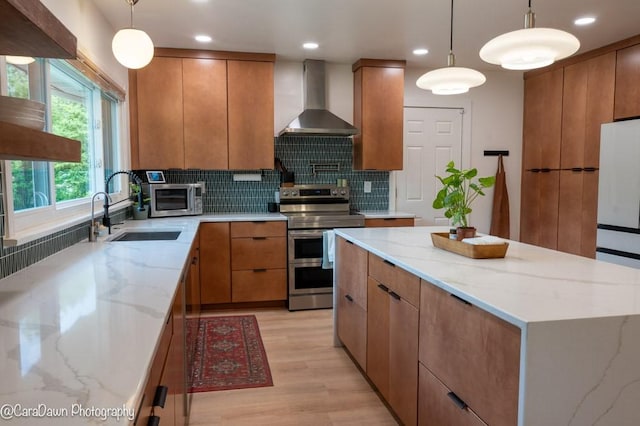 8 Windycrest Dr, Patterson Twp, PA 15010 - kitchen with wall chimney exhaust hood, stainless steel appliances, decorative backsplash, light wood finished floors, and light stone countertops