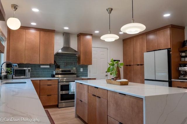 8 Windycrest Dr, Patterson Twp, PA 15010 - kitchen with wall chimney exhaust hood, appliances with stainless steel finishes, backsplash, light stone countertops, and brown cabinetry