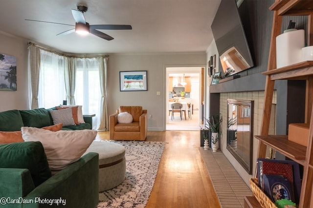 8 Windycrest Dr, Patterson Twp, PA 15010 - living room featuring light wood-type flooring, ceiling fan, a fireplace, and ornamental molding