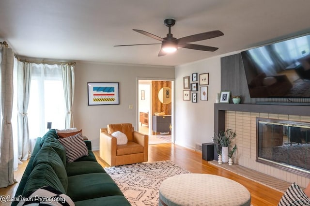 8 Windycrest Dr, Patterson Twp, PA 15010 - living room featuring wood finished floors, ceiling fan, crown molding, and a fireplace
