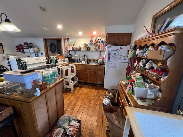 13478 Old Lake Rd Unit 63, Springfield, PA 16411 - kitchen featuring freestanding refrigerator, light wood-style flooring, brown cabinets, and recessed lighting