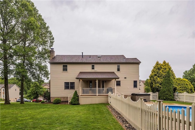 108 Birchwood Way, Penn Twp Wml, PA 15642 - back of property with a hot tub and a chimney