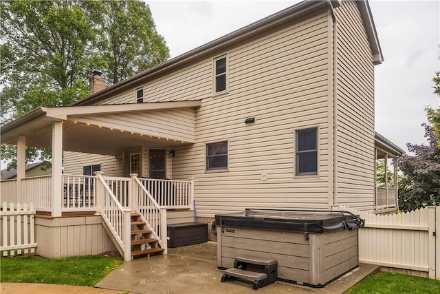 108 Birchwood Way, Penn Twp Wml, PA 15642 - back of property featuring a hot tub, a chimney, a patio, and a wooden deck