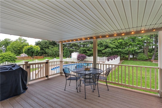 108 Birchwood Way, Penn Twp Wml, PA 15642 - wooden deck featuring outdoor dining space, a storage shed, a fenced backyard, and area for grilling