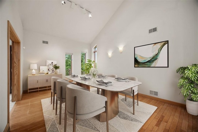 240 Rte 88, Monongahela, PA 15063 - dining room with track lighting, high vaulted ceiling, and light wood-style floors