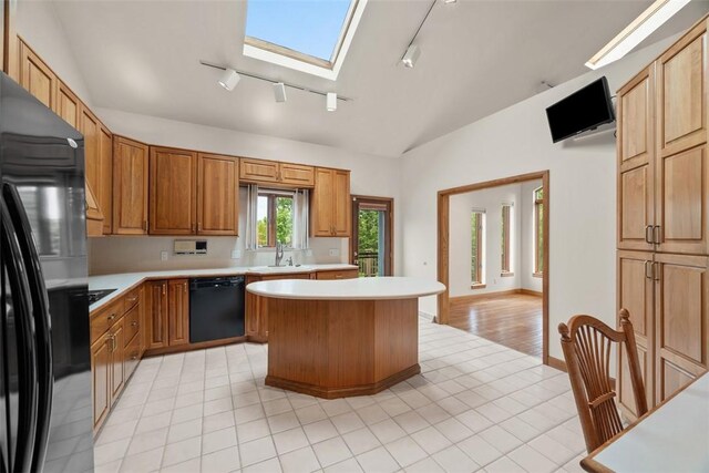 240 Rte 88, Monongahela, PA 15063 - kitchen with black appliances, track lighting, light countertops, lofted ceiling, and a kitchen island