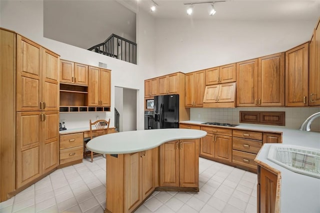 240 Rte 88, Monongahela, PA 15063 - kitchen with black appliances, rail lighting, high vaulted ceiling, built in desk, and a center island