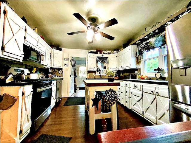 5569 Bull Creek Rd, Fawn Twp, PA 15084 - kitchen featuring electric stove, black microwave, dark countertops, a ceiling fan, and white cabinetry
