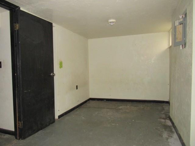 129 Windsor Dr, Penn Hills, PA 15235 - empty room with concrete floors and baseboards