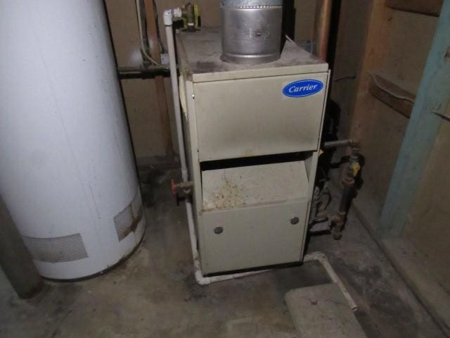 129 Windsor Dr, Penn Hills, PA 15235 - utility room featuring water heater and heating unit