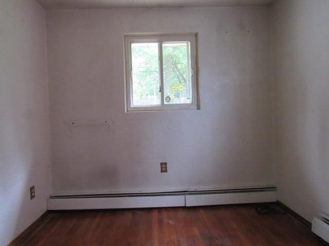 129 Windsor Dr, Penn Hills, PA 15235 - empty room featuring a baseboard radiator and wood finished floors