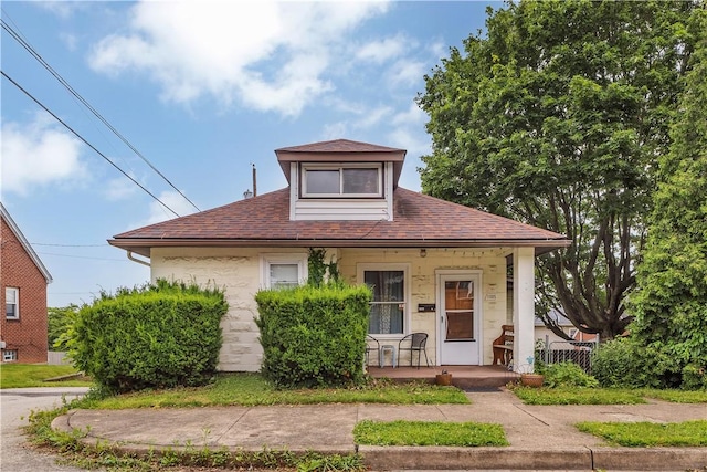 1505 Raymond Ave, Latrobe, PA 15650 - bungalow-style home featuring covered porch and a shingled roof